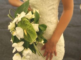 Traditional white dress with a bouquet of flowers